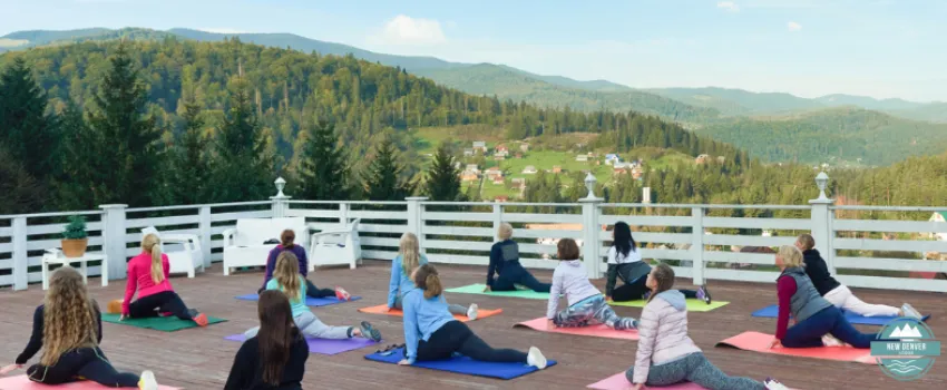 NDL - A group of women practicing yoga in the mountains